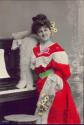 Junge Frau am Klavier ca. 1910 koloriert